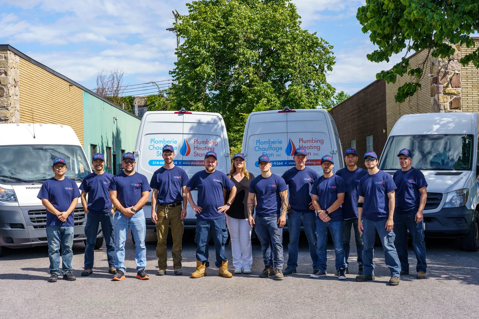 The Stan plumbing team in front of the vans